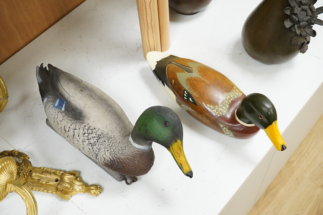 A decoy duck-42cm long, with a carved and painted wooden model of a duck. (2).